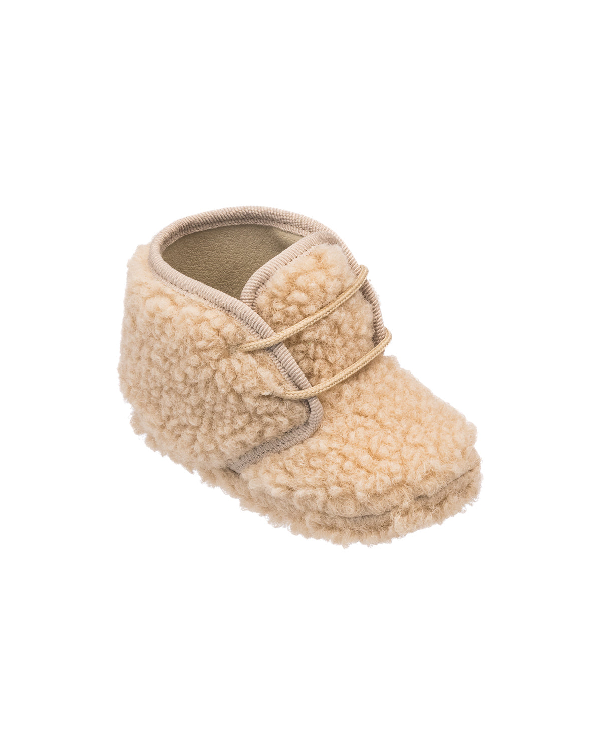 Beige shearling baby bootie with soft textured exterior and leather trim lace closure.