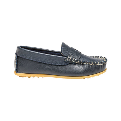 Navy blue boys leather loafer with moccasin stitching and tan rubber sole.