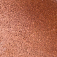 Natural brown smooth leather with fine grain texture close-up.