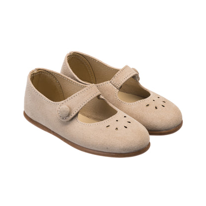Beige suede toddler Mary Jane shoes with button strap and perforated toe details.