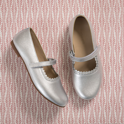 Silver leather toddler Mary Jane shoes with scalloped edges and a single strap closure.