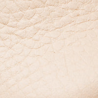 Cream-colored soft leather with textured grain for baby shoes.