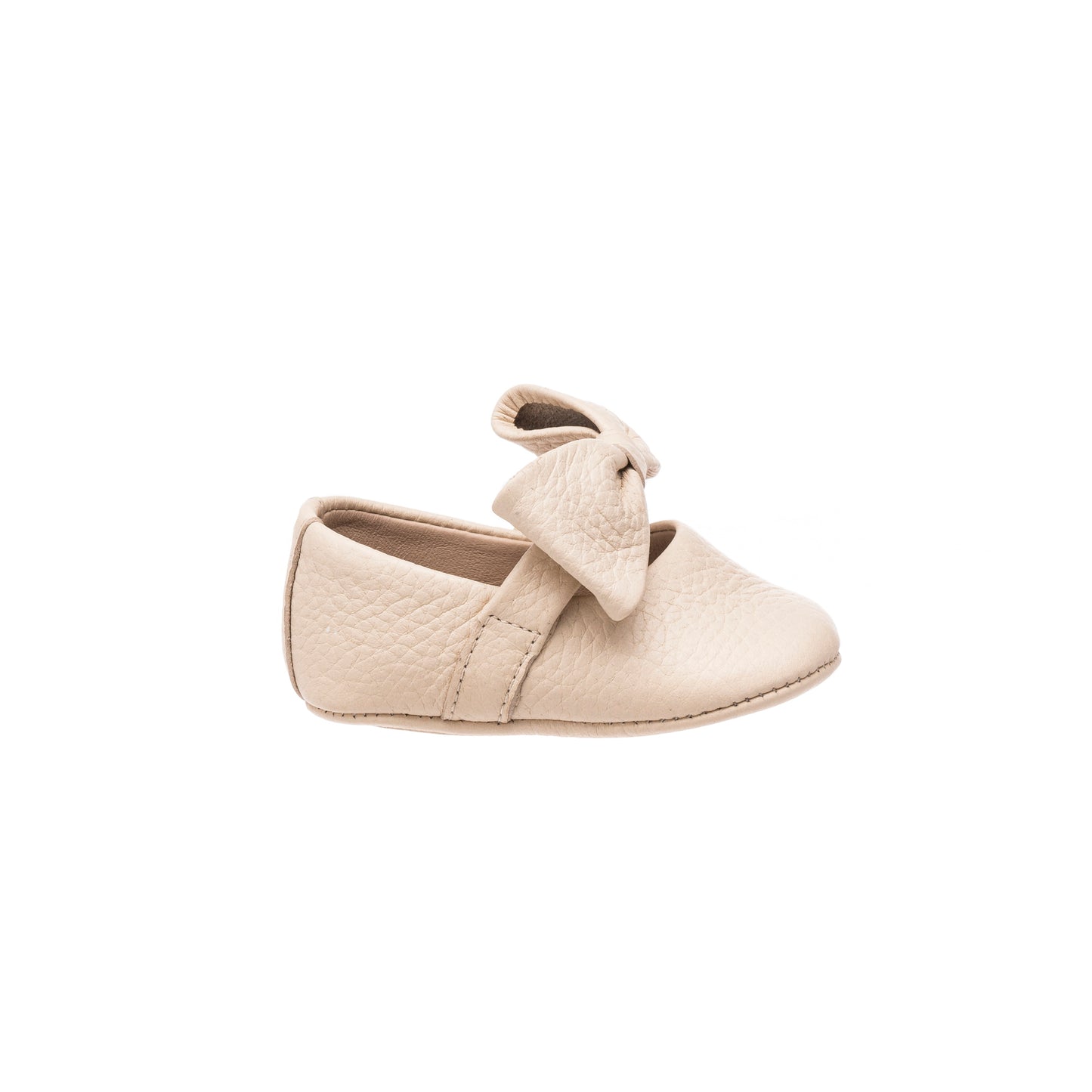 Cream leather baby ballerina shoe with large decorative bow and soft sole.