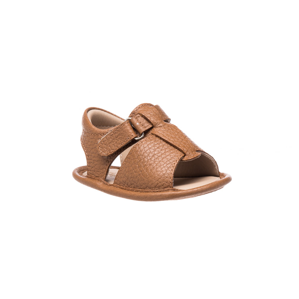 Caramel brown toddler sandal with textured straps and adjustable buckle closure.