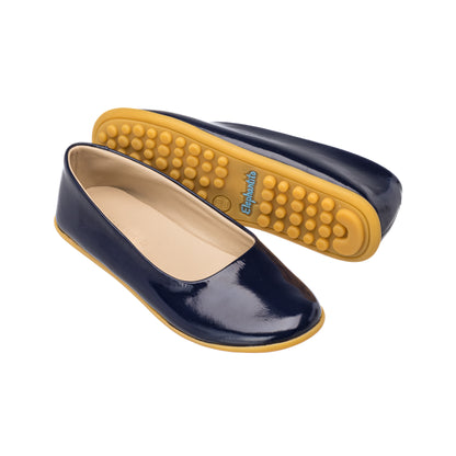 Elephantito - Navy blue patent leather toddler ballerina flats with cushioned tan rubber sole and rounded toe.