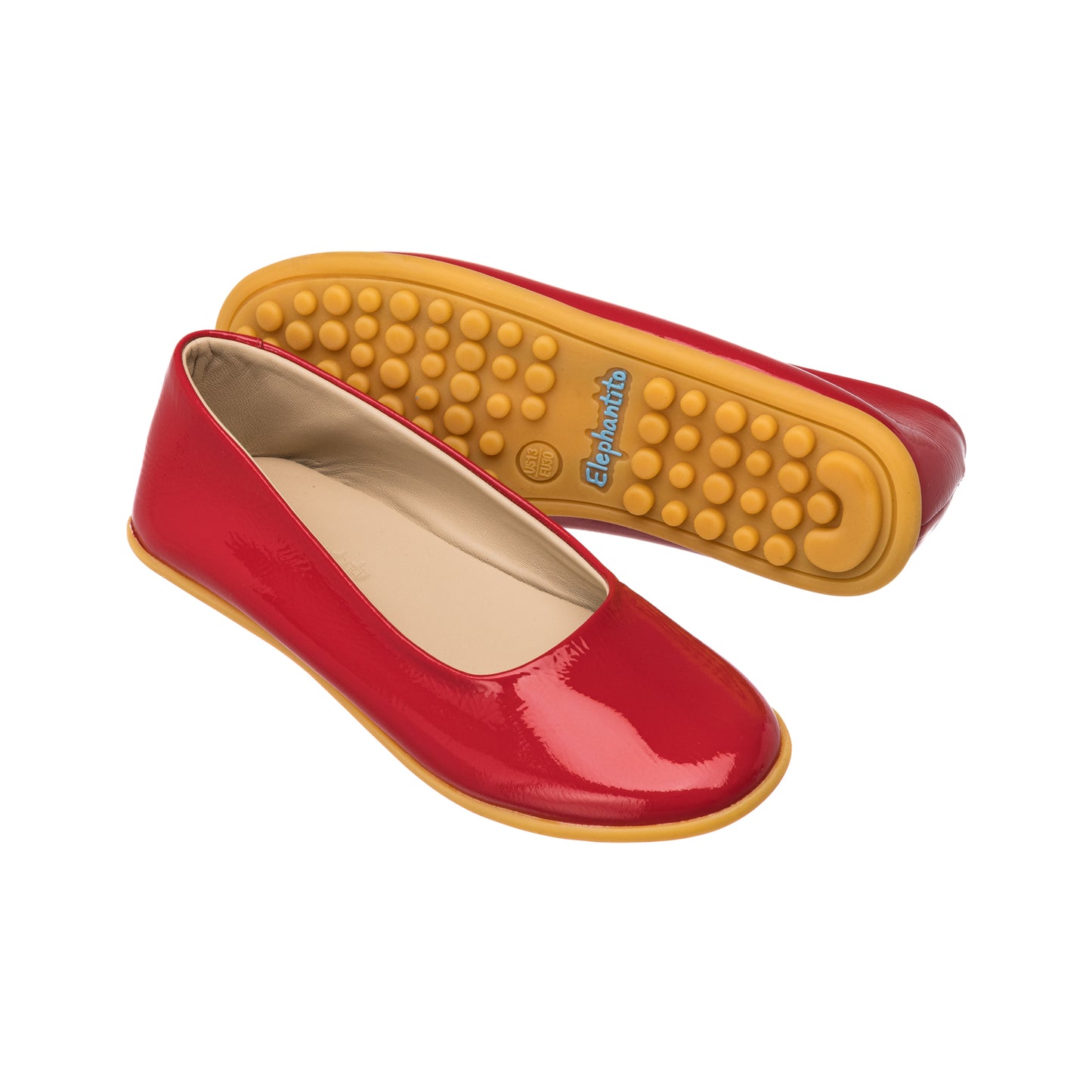 Red glossy ballerina flats for children with flexible yellow soles and rounded toes.