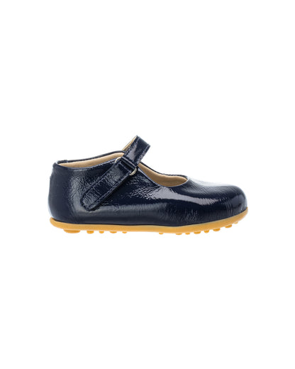 Navy blue patent leather toddler Mary Jane shoe with adjustable Velcro strap and rubber sole.