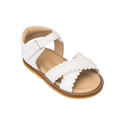 Elephantito - White toddler sandal with scalloped leather straps and cushioned tan sole.