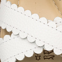 Elephantito - White toddler sandal with scalloped edges and textured leather straps.