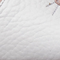 White toddler sandal with textured leather and subtle bunny ear design detail.