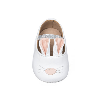 White baby slipper with soft pink bunny ears and embroidered nose and whiskers.