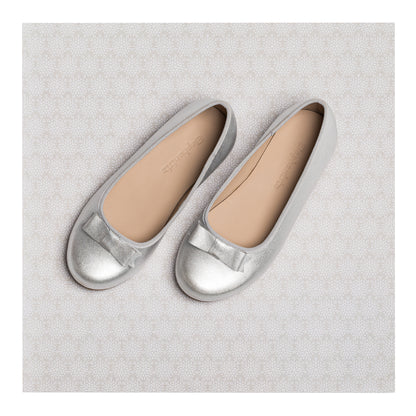 Silver metallic girls' ballet flats with rounded toes and a small bow detail on top.