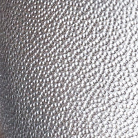 Close-up of textured silver leather material for children's Camille Flats shoes.