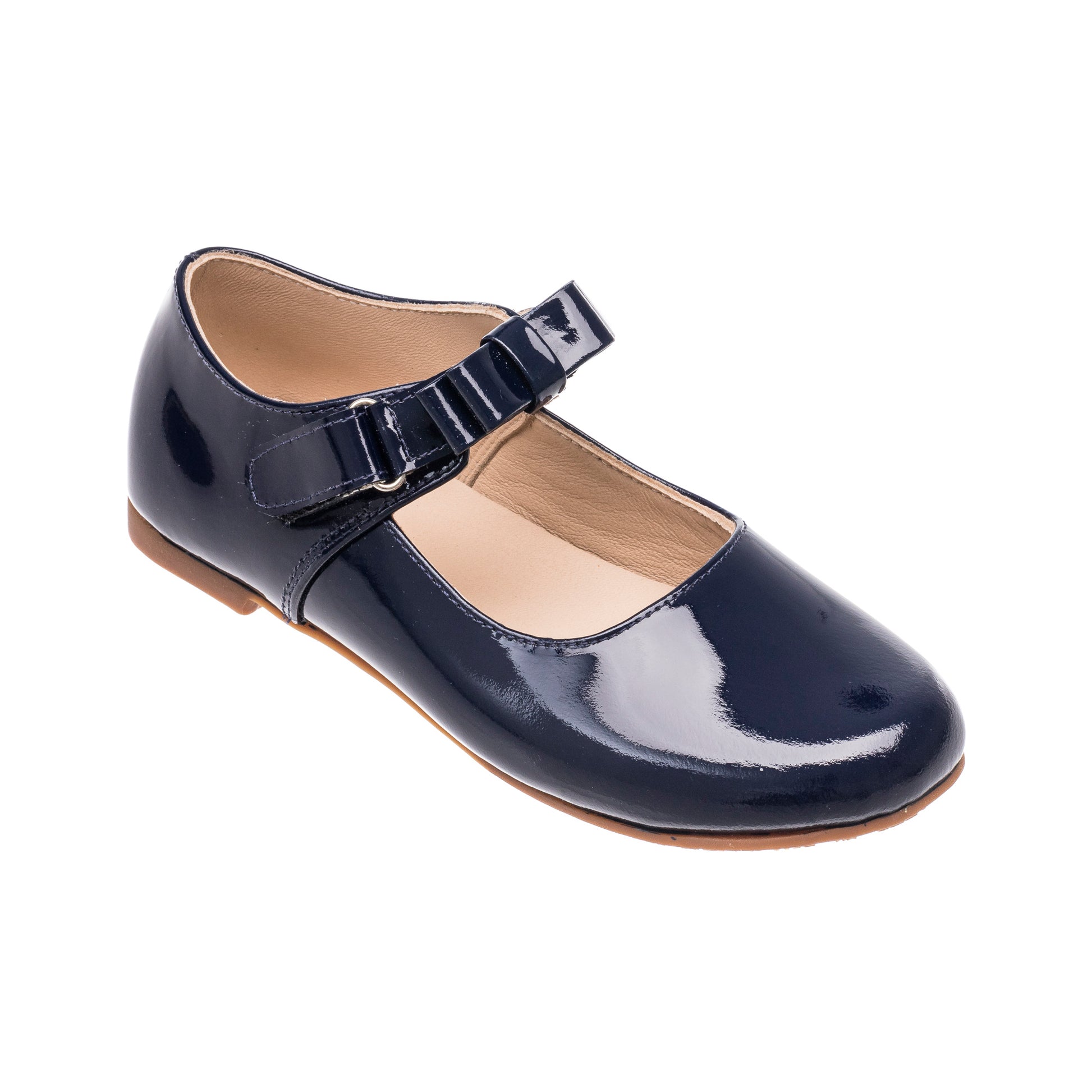 Glossy navy blue patent leather Mary Jane shoe with buckle strap and tan sole for girls.