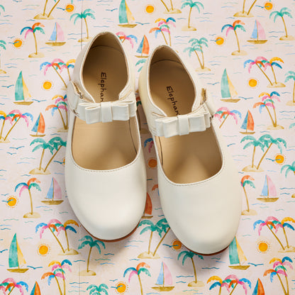 Elephantito - Bone-colored toddler Mary Jane shoes with a small bow and adjustable strap.