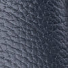 Close-up of navy blue pebbled leather texture on boys' loafers.