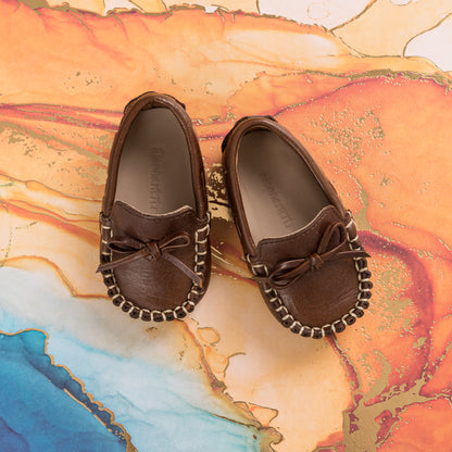 Brown leather baby loafers with bow detail and contrast stitching on round toes.
