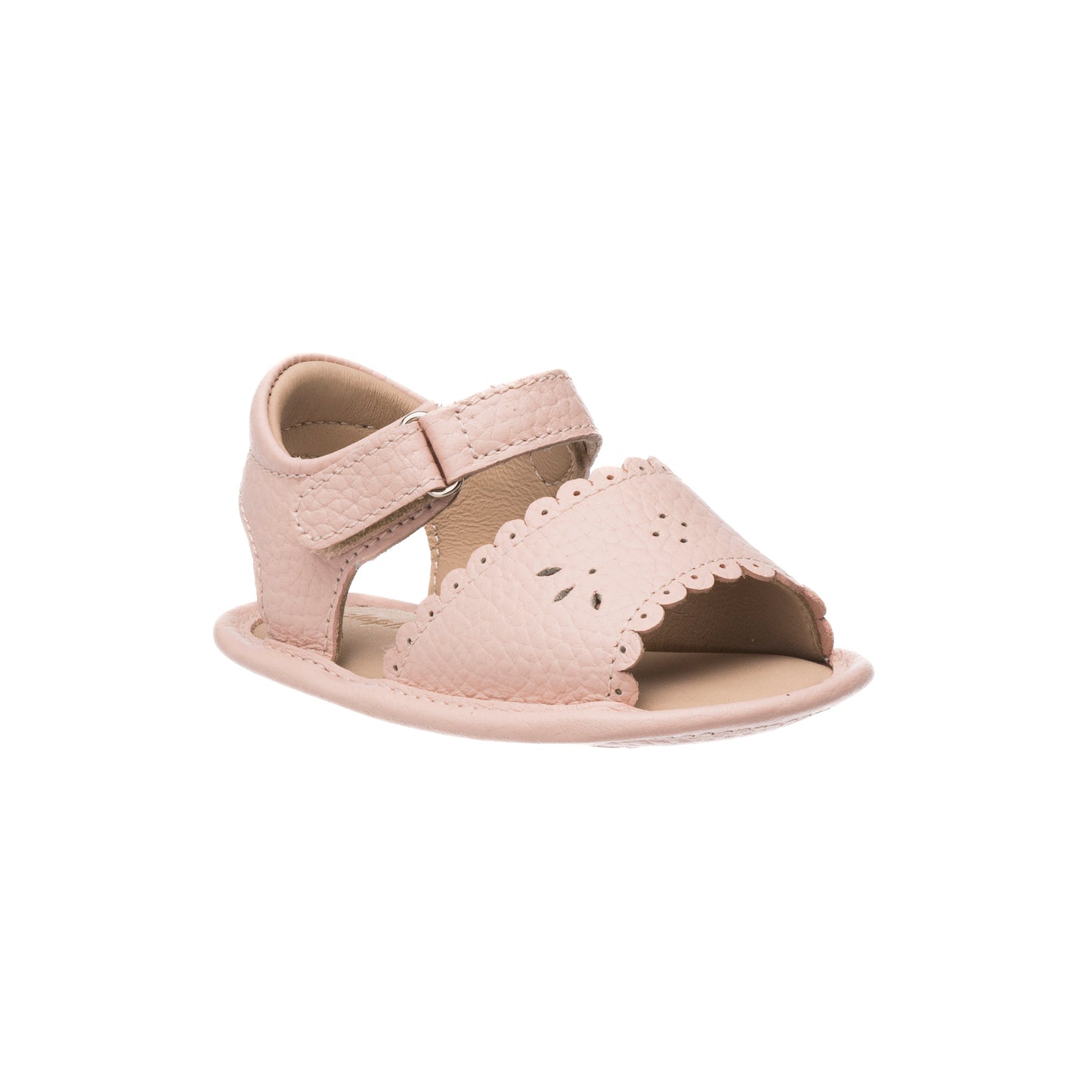 Pink toddler sandal with scalloped edges and perforated floral design, adjustable velcro strap.