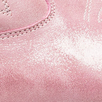 Close-up of metallic pink suede toddler boot with neat stitching and soft texture.