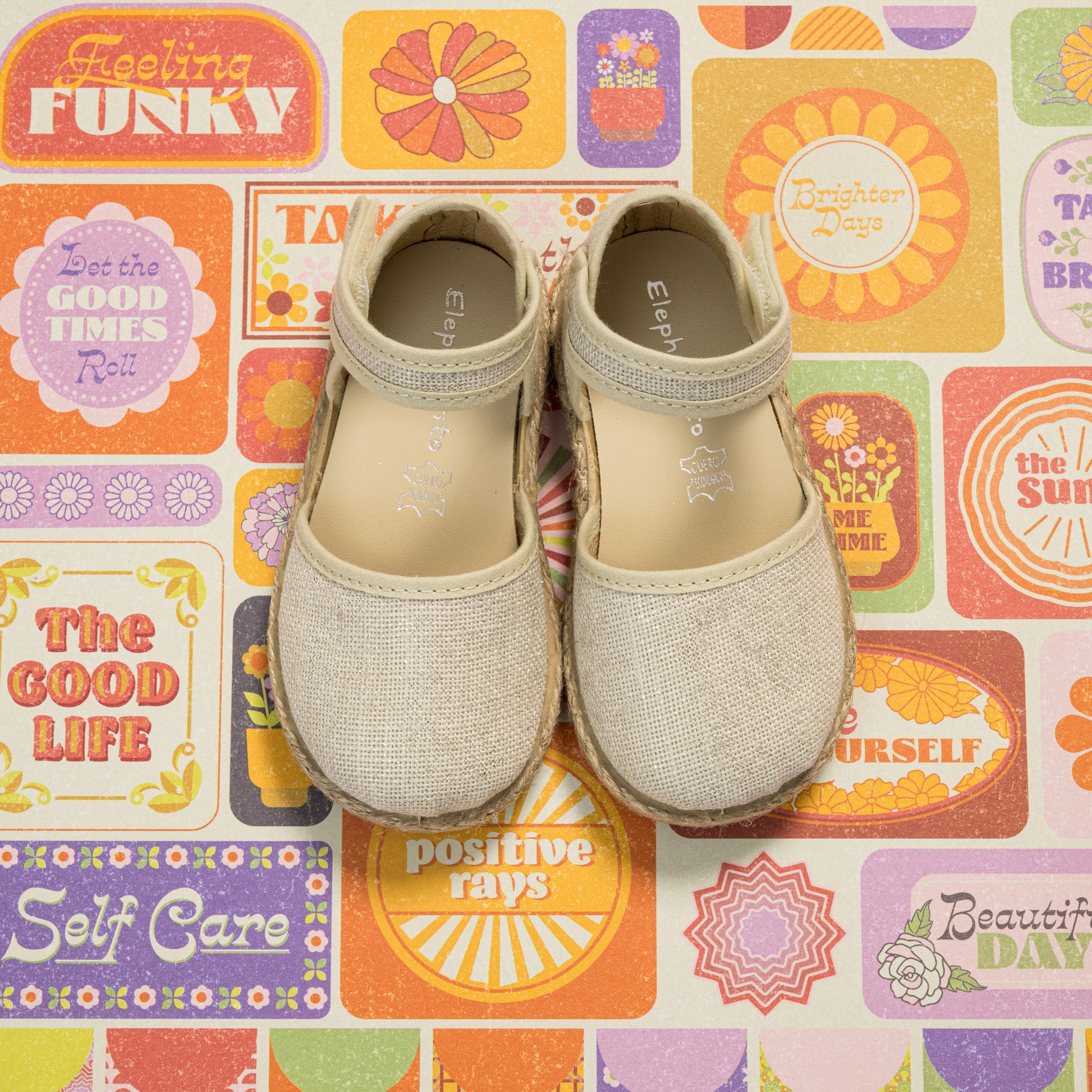 Metallic white linen espadrille with Mary Jane strap and jute sole for toddlers and kids.