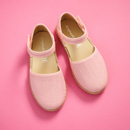 Elephantito - Pink linen espadrille sandals for girls with ankle straps and woven jute soles on a pink background.