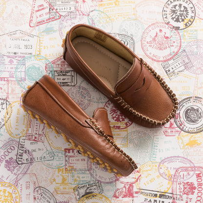 Natural brown boys loafers with stitched moccasin design and soft leather material.