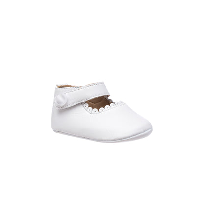 White baby Mary Jane shoe with scalloped edge and velcro strap closure.