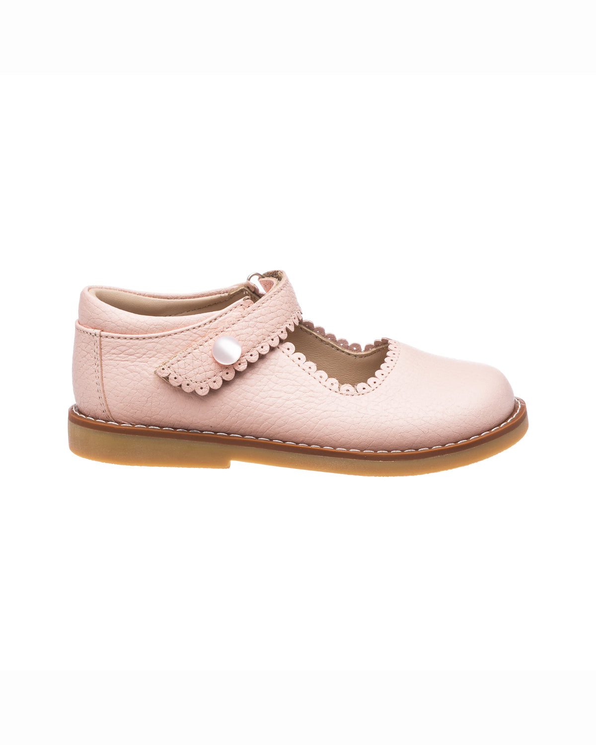 Pink leather Mary Jane shoe for girls with scalloped edges and pearl button strap.