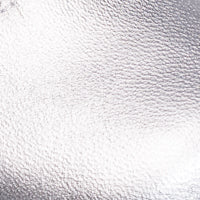 Close-up of shiny silver textured leather material for children's Mary Jane shoes.
