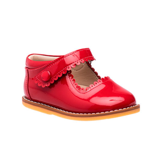 Red patent leather toddler Mary Jane shoe with scalloped strap and floral detail.
