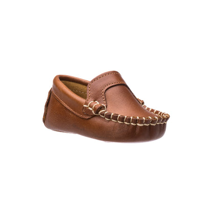 Natural brown baby moccasin with leather upper and whipstitch detailing.