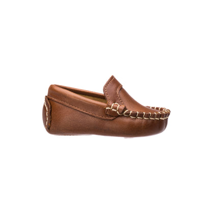 Natural brown leather baby moccasin with hand-stitched detailing and soft sole.