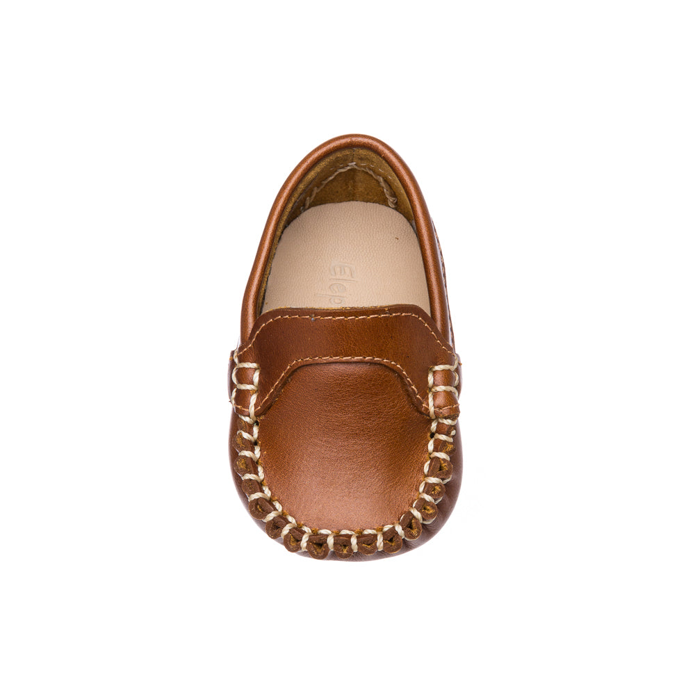 Natural brown baby moccasin with stitched detailing and soft leather upper, toddler size.
