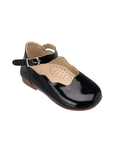 Black patent leather toddler flats with scalloped edges and ankle strap buckle closure.