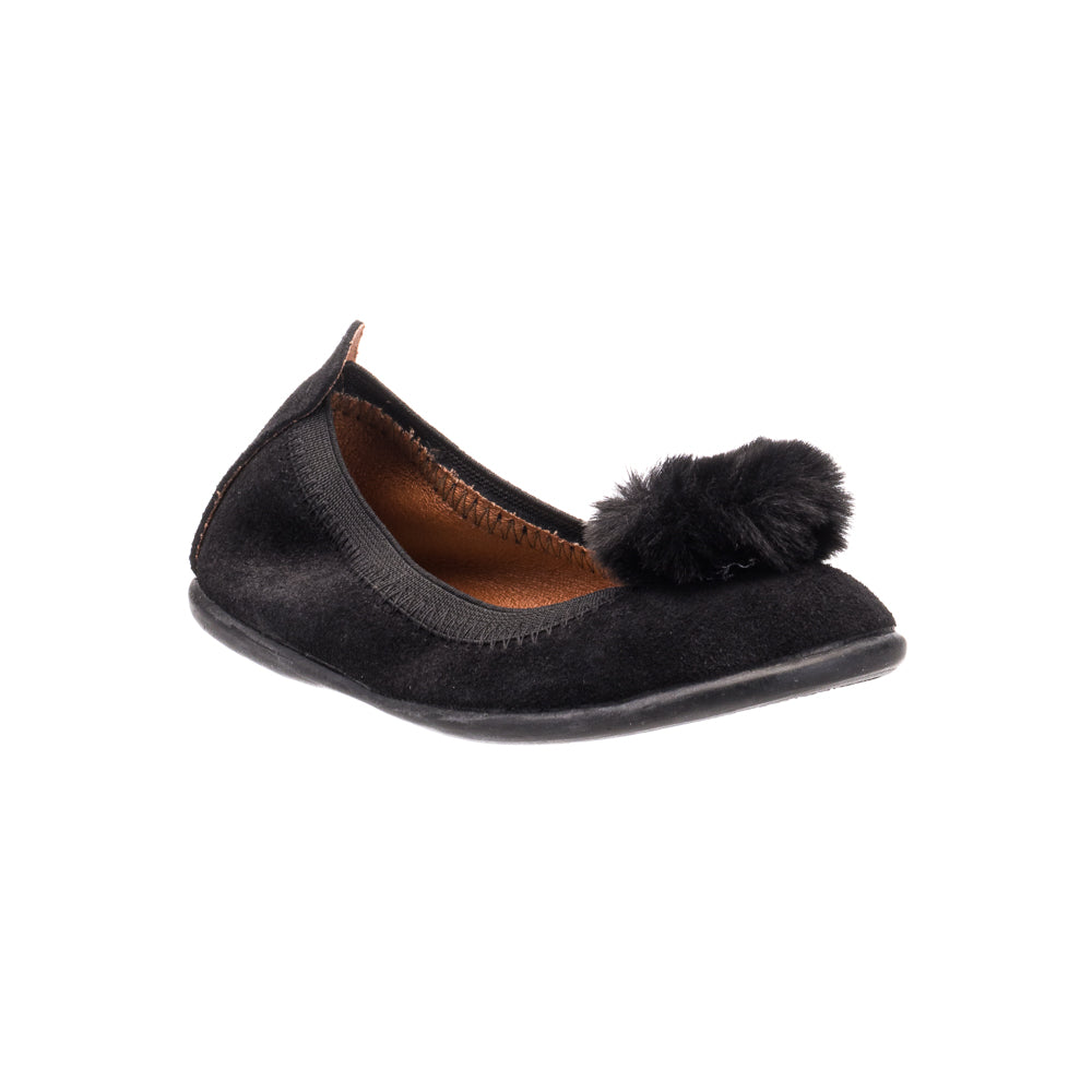 Black suede ballerina flat with a soft pom pom on the toe and a leather-lined interior.