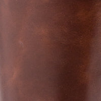 Brown leather riding boot with smooth finish and subtle texture.