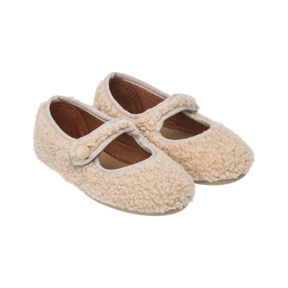 Beige toddler Mary Jane shoes with soft shearling texture and buttoned strap closure.