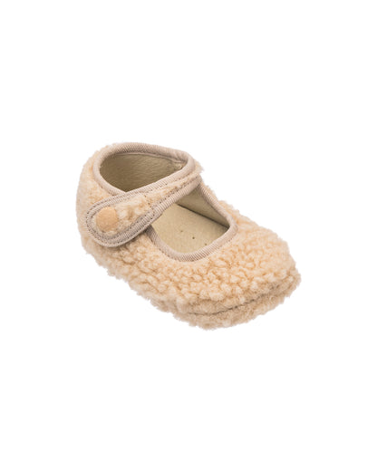 Beige shearling baby Mary Jane with a hook-and-loop strap and soft textured upper.