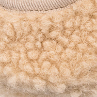 Beige shearling Mary Jane baby shoe with textured wool upper and ribbed knit trim.