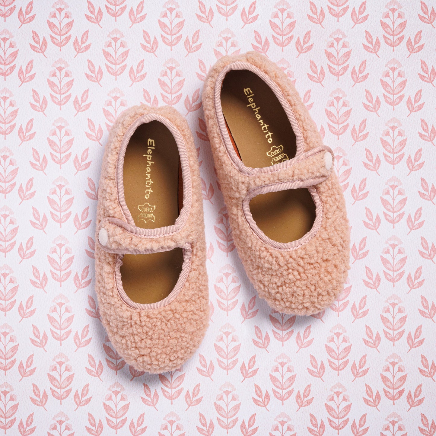 Pink shearling Mary Jane shoes for toddlers with a single strap and rounded toe.