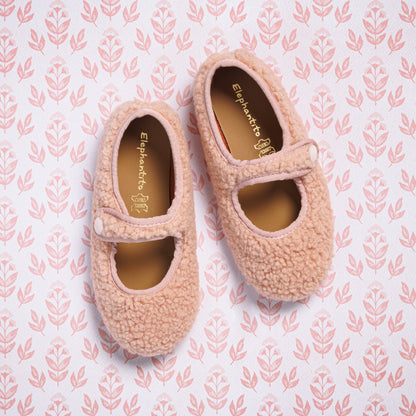 Pink shearling Mary Jane shoes for toddlers with a single strap and rounded toe.