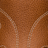 Elephantito - Close-up of caramel-colored textured leather with white decorative stitching on children’s sandal.