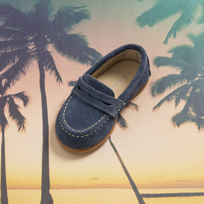 Navy blue suede penny loafer for toddlers with contrast stitching and penny strap on top.