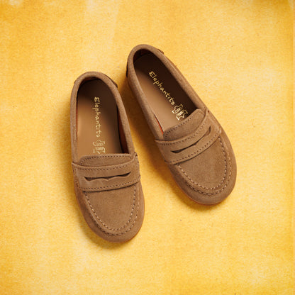 Toffee brown suede boys penny loafers with moccasin stitching and a classic slip-on design.