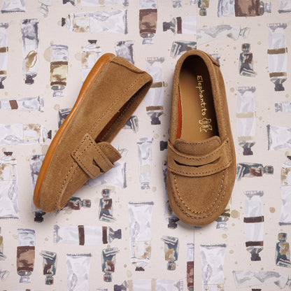 Toffee brown suede penny loafer with stitched moccasin toe and a classic strap detail.