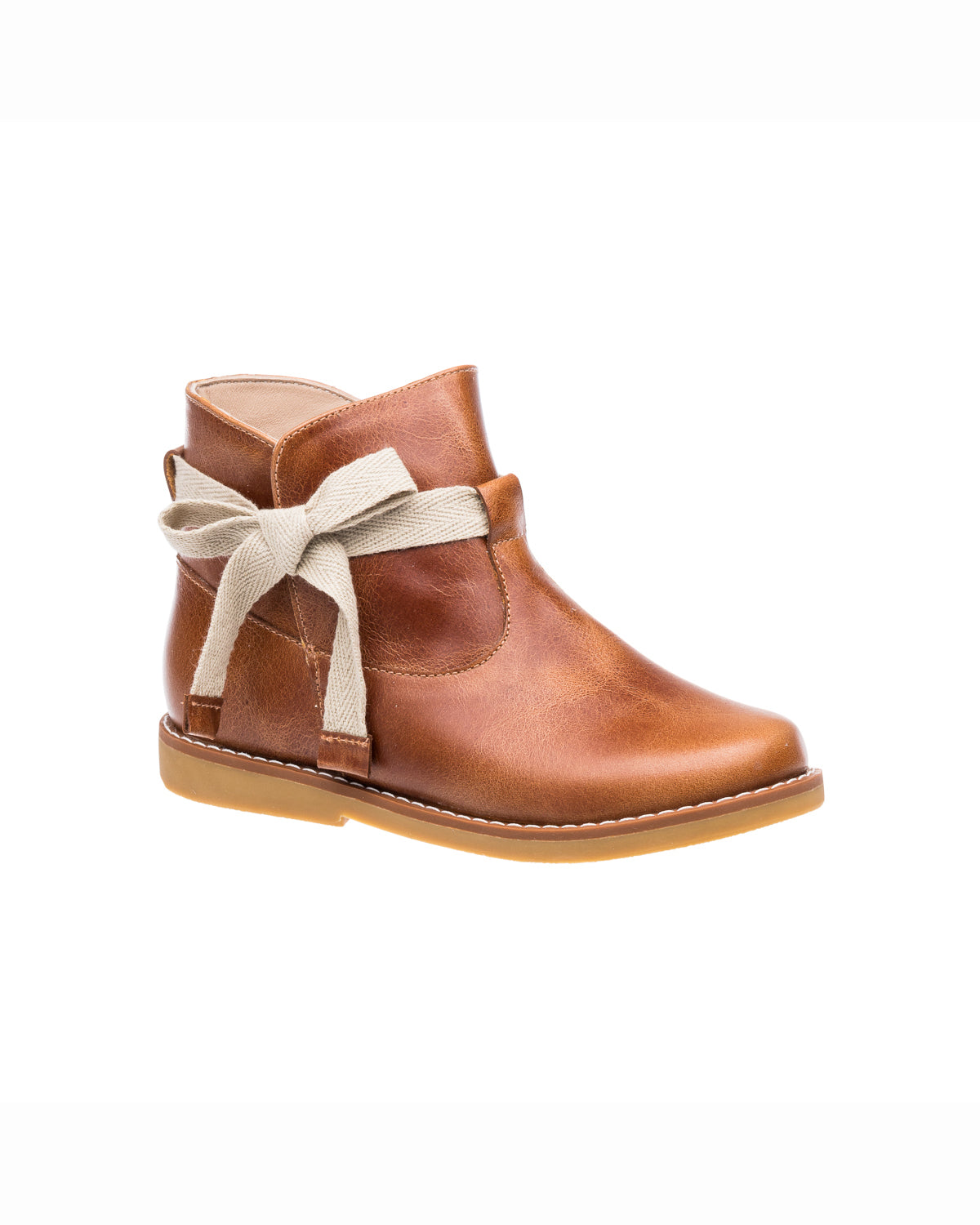 Brown leather toddler bootie with side cutouts and cream fabric bow detail.