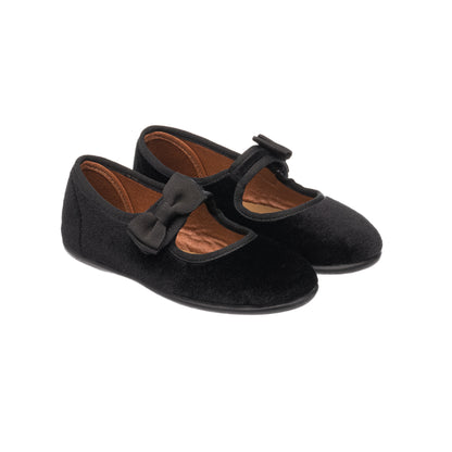 Black velvet Mary Jane shoes for toddlers with decorative bow and rounded toe.
