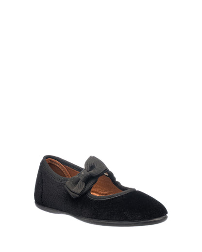 Black velvet Mary Jane shoe with a bow detail and flat sole for toddlers.