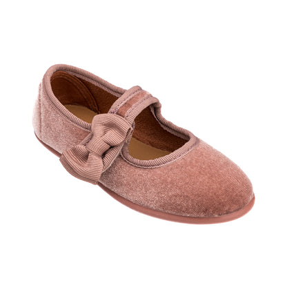 Pink velvet Mary Jane shoe with a decorative bow on the strap for toddlers.