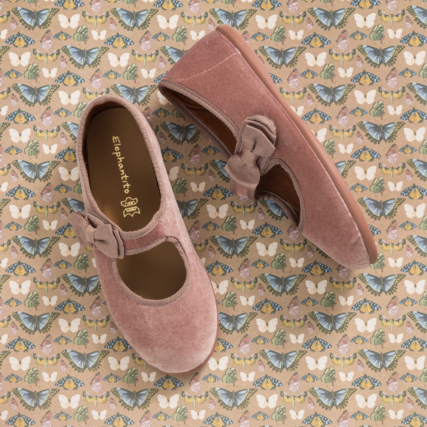 Dusty rose velvet Mary Jane shoes for toddlers with decorative bows and rounded toes.